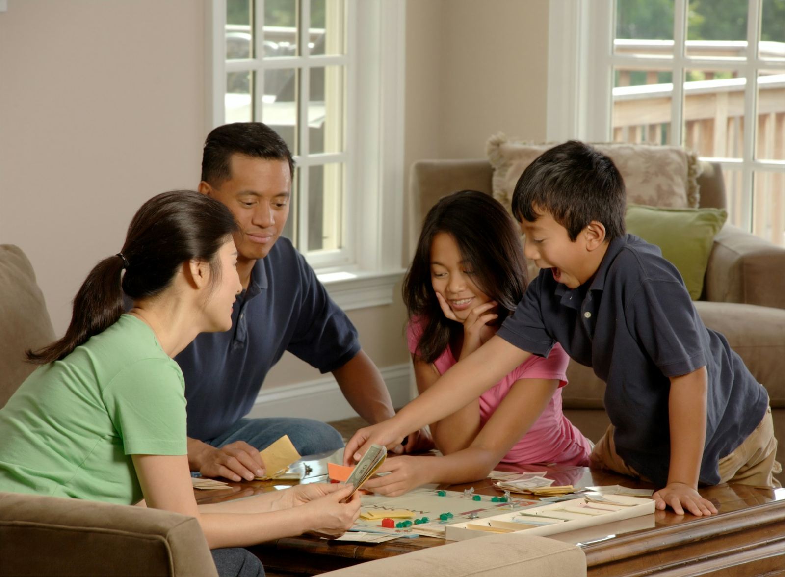 A family playing a board game together at home